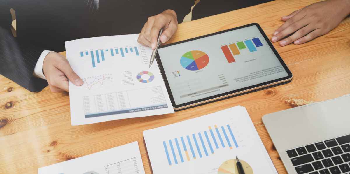 person holding white printer paper